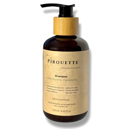 A bottle of Pirouette Beauty's natural shampoo with organic ingredients.